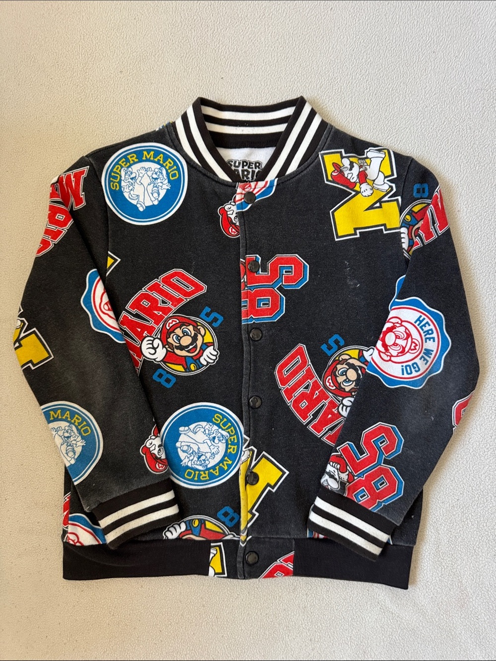 Nintendo Black Super Mario Patchwork Bomber Jacket with Red & Yellow Accents